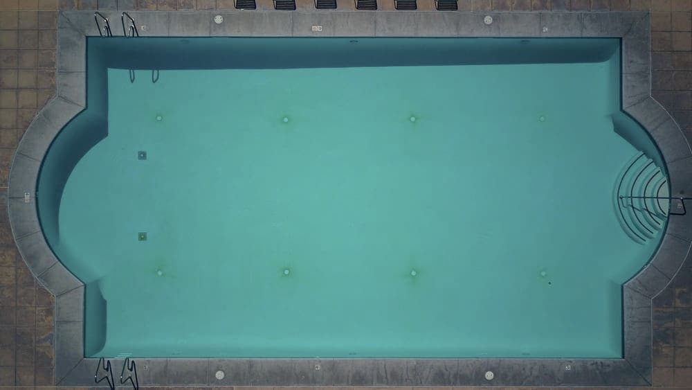 A rectangular inground swimming pool seen from above