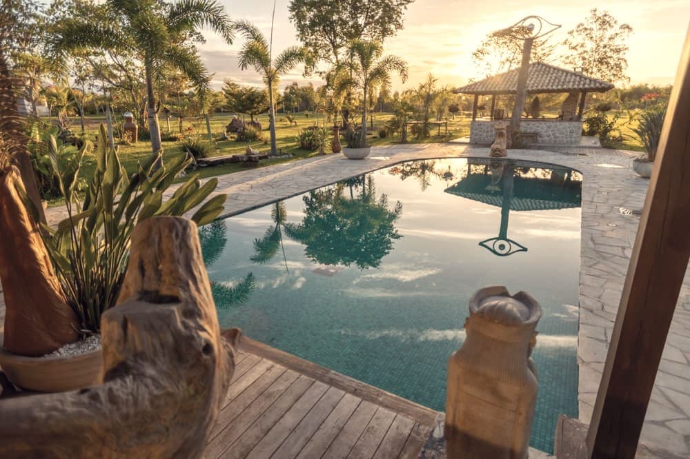 A backyard pool in early morning light