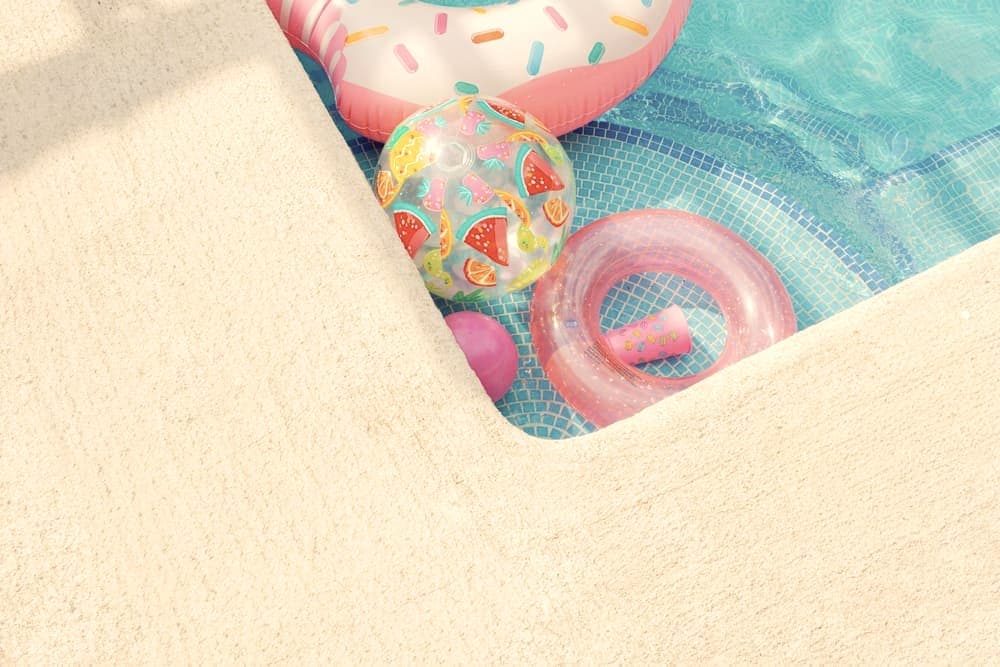 A circular float resting on the surface of a pool